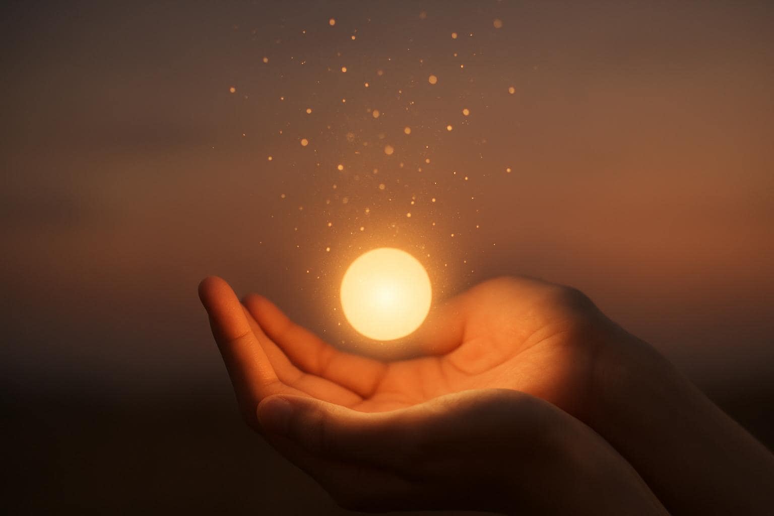 Hands cupping a glowing light representing trust and abundance connected to angel number 60